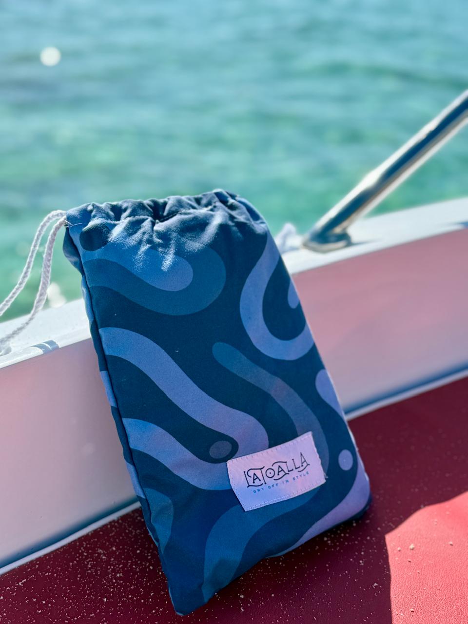 La Toalla Beach Towel Pouch on a yacht at the beach