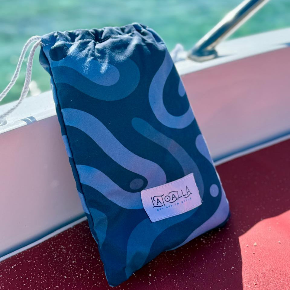 La Toalla Beach Towel Pouch on a yacht at the beach