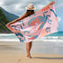 Girl on the beach holding a Quick Dry, Sand Free, Light Weight, Compact and Ecofriendly Microfiber Beach Towel from La Toalla